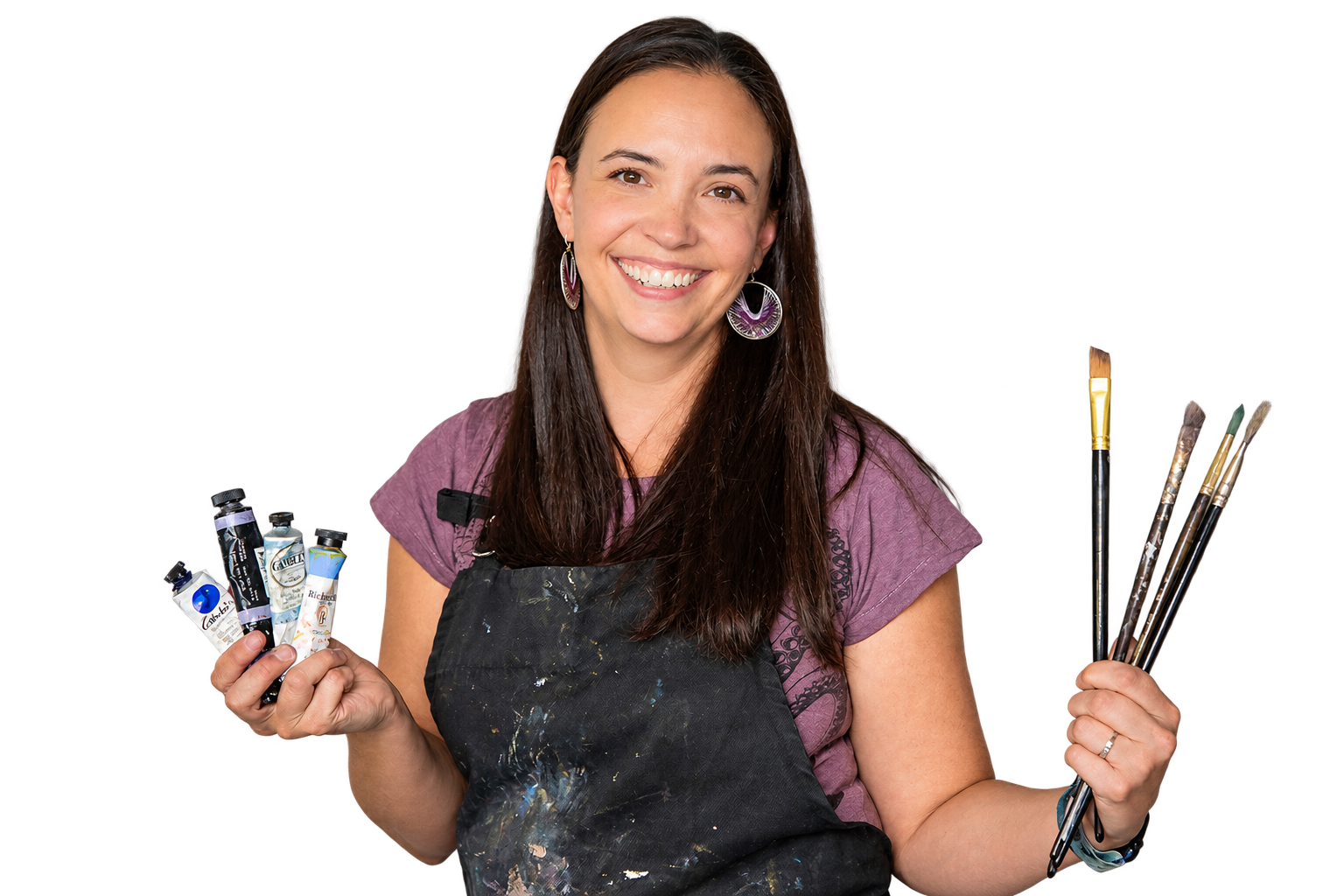 Andrea Gianchiglia smiling and holding paint tubes and brushes